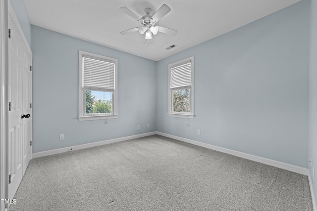 unfurnished room featuring carpet and ceiling fan