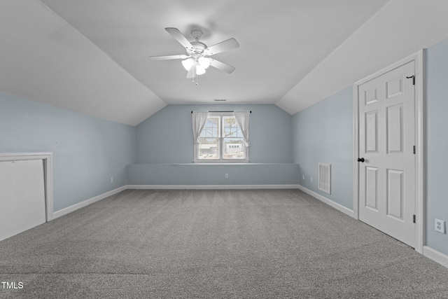 bonus room with ceiling fan, carpet floors, and vaulted ceiling