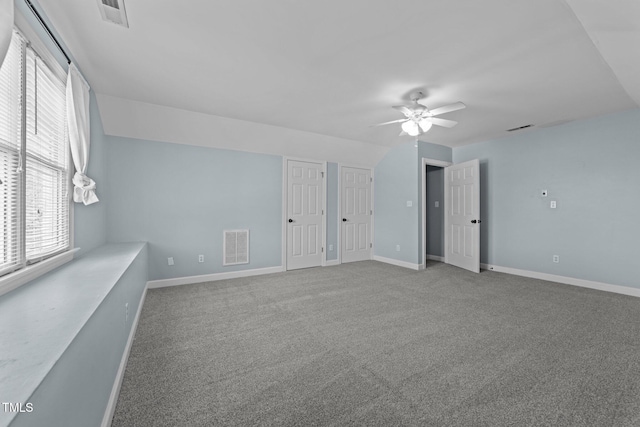 spare room featuring carpet and ceiling fan