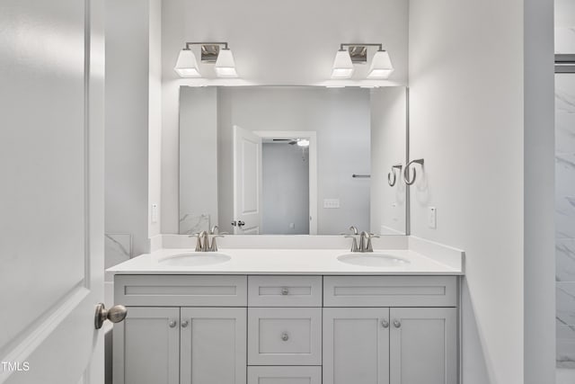 full bath featuring a sink and double vanity