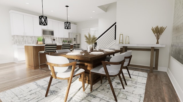 dining area with light hardwood / wood-style floors