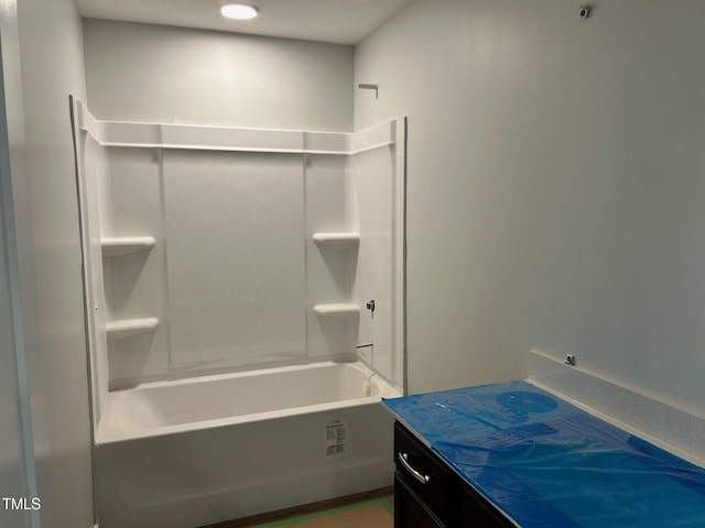 bathroom featuring vanity and shower / bath combination