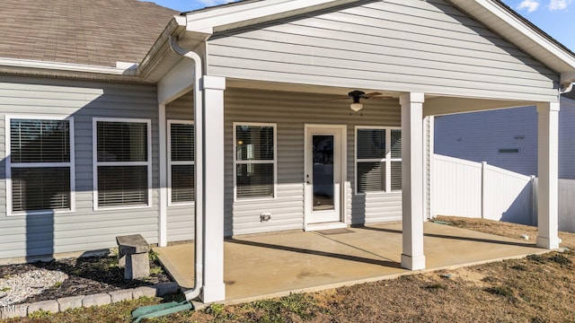 exterior space featuring fence and a ceiling fan