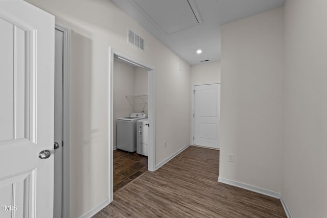 hall featuring separate washer and dryer and dark hardwood / wood-style flooring