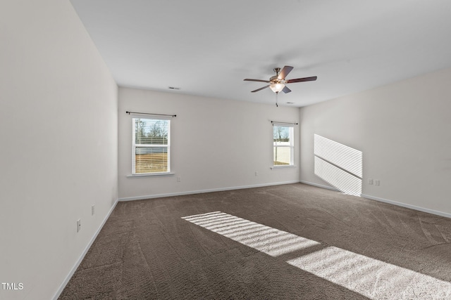 carpeted empty room featuring ceiling fan