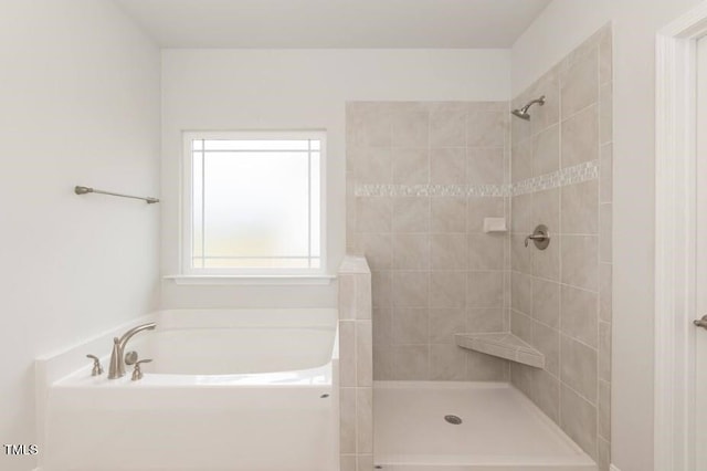 bathroom with separate shower and tub