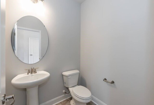 bathroom with sink and toilet