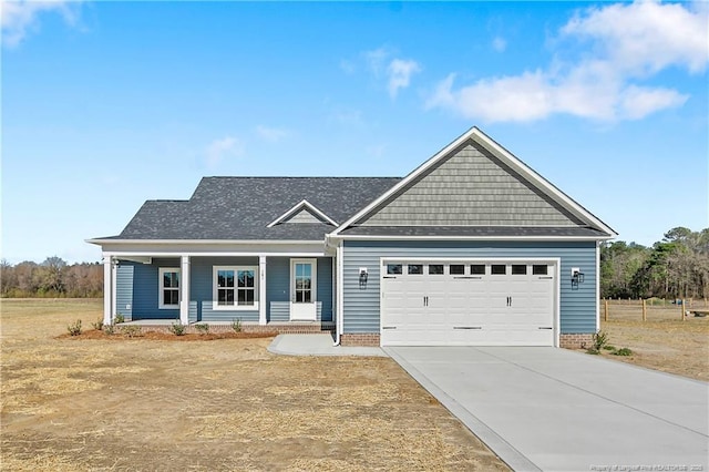 view of front of property with concrete driveway and an attached garage