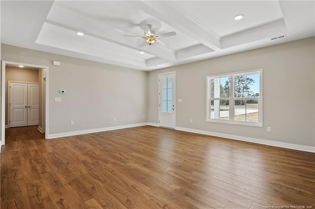 empty room featuring recessed lighting, visible vents, baseboards, and hardwood / wood-style floors