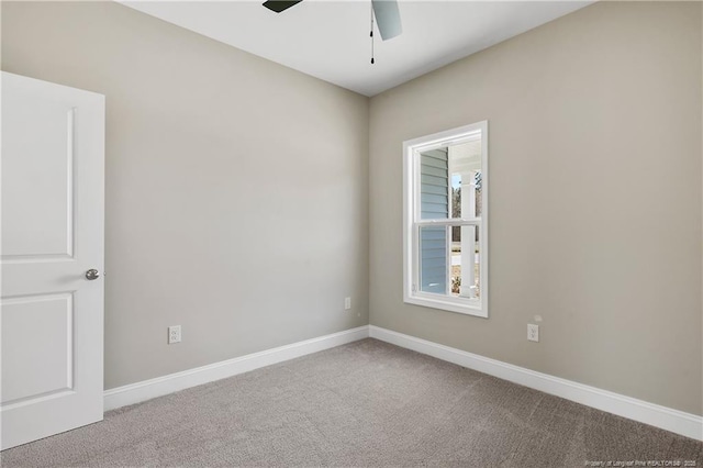 empty room with a ceiling fan, baseboards, and carpet floors