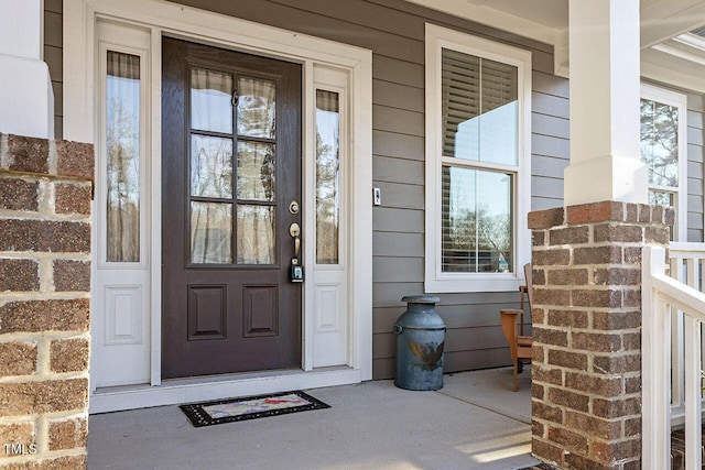 doorway to property with covered porch