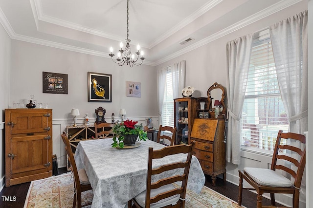 dining room with a notable chandelier, dark hardwood / wood-style flooring, and plenty of natural light