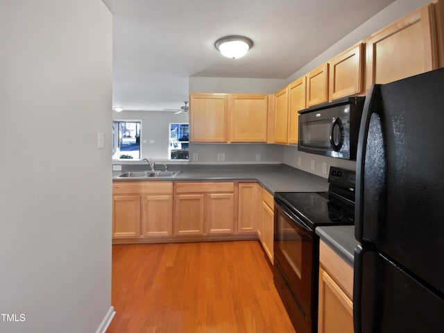 kitchen featuring light brown cabinets, black appliances, sink, light hardwood / wood-style flooring, and ceiling fan