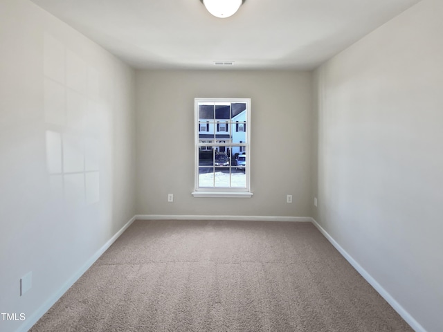 unfurnished room featuring carpet floors