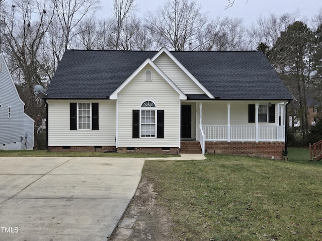 view of front of house with covered porch and a front lawn