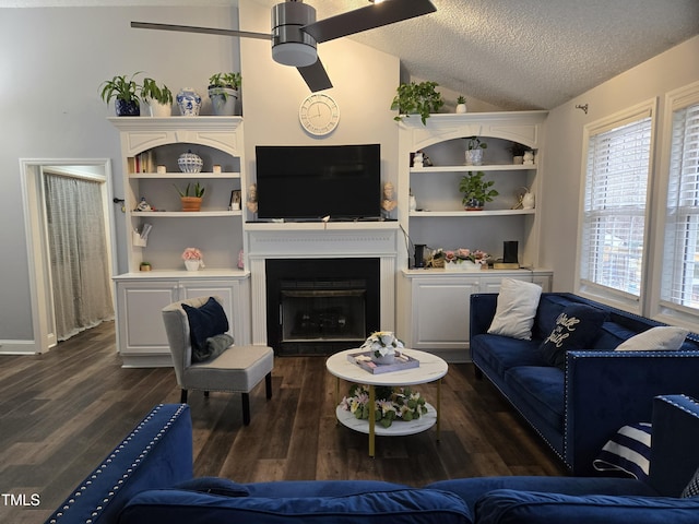 living room with ceiling fan, dark hardwood / wood-style floors, a textured ceiling, and vaulted ceiling