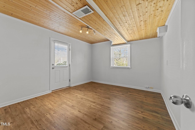 empty room featuring crown molding, hardwood / wood-style floors, and wooden ceiling