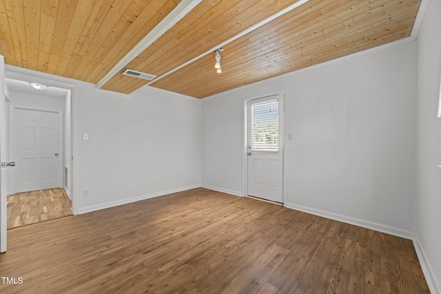 unfurnished room with hardwood / wood-style flooring, wood ceiling, and track lighting