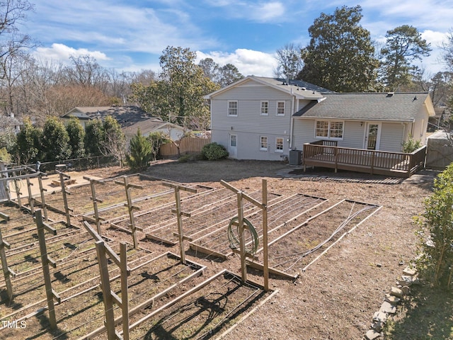 back of house featuring a deck and central air condition unit