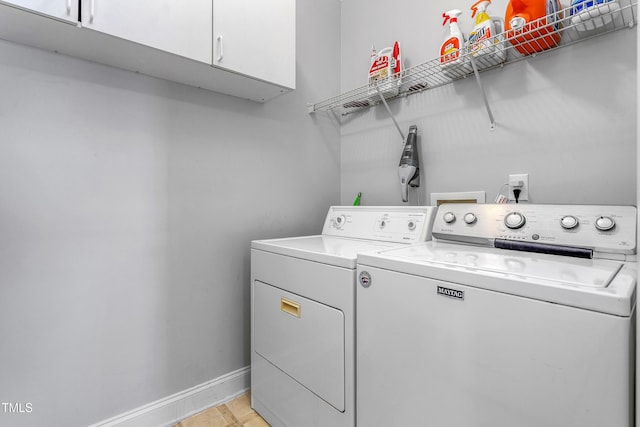 laundry room featuring cabinets and independent washer and dryer