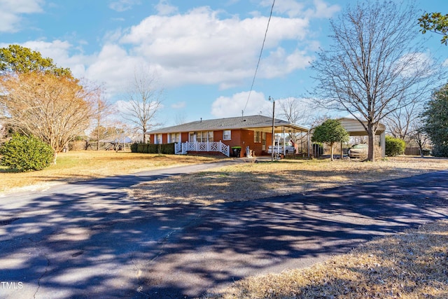 view of front of home featuring a carport