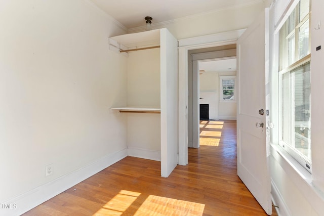 1308 Wake Forest Rd, Raleigh, NC 27604 - hall with light wood-style floors, ornamental molding, and baseboards