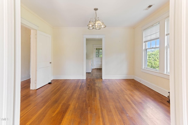1308 Wake Forest Rd, Raleigh, NC 27604 - unfurnished room featuring a chandelier, hardwood / wood-style flooring, crown molding, and baseboards