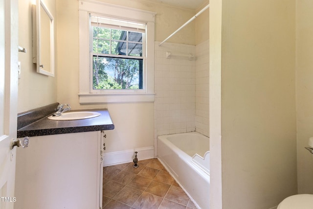 1308 Wake Forest Rd, Raleigh, NC 27604 - full bath featuring toilet, vanity, baseboards, shower / bathtub combination, and tile patterned flooring
