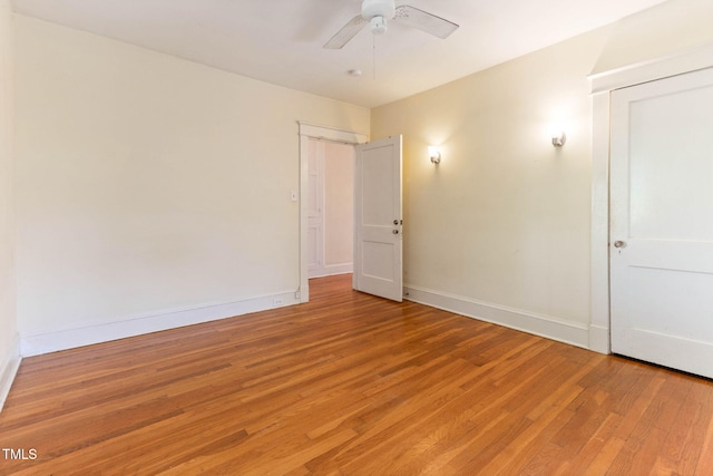 1308 Wake Forest Rd, Raleigh, NC 27604 - unfurnished bedroom with light wood-style floors, baseboards, and ceiling fan
