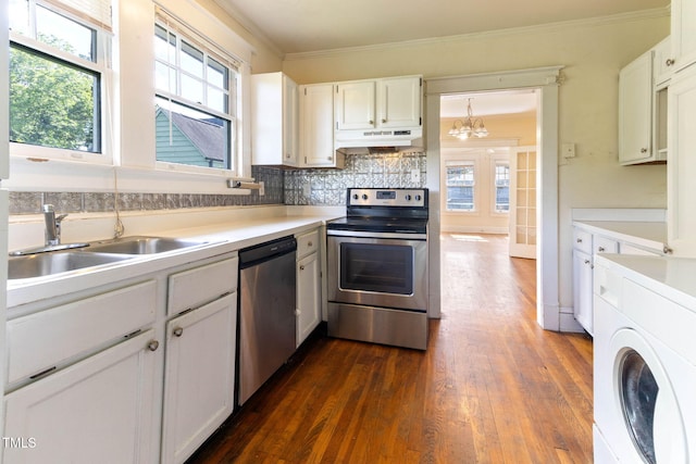 1308 Wake Forest Rd, Raleigh, NC 27604 - kitchen with appliances with stainless steel finishes, washer / clothes dryer, under cabinet range hood, a sink, and crown molding