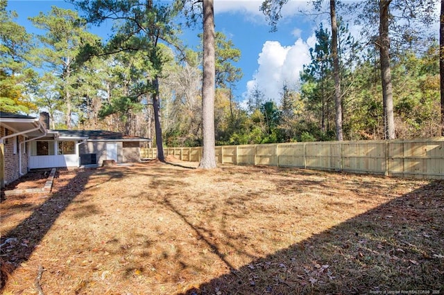 view of yard featuring a sunroom