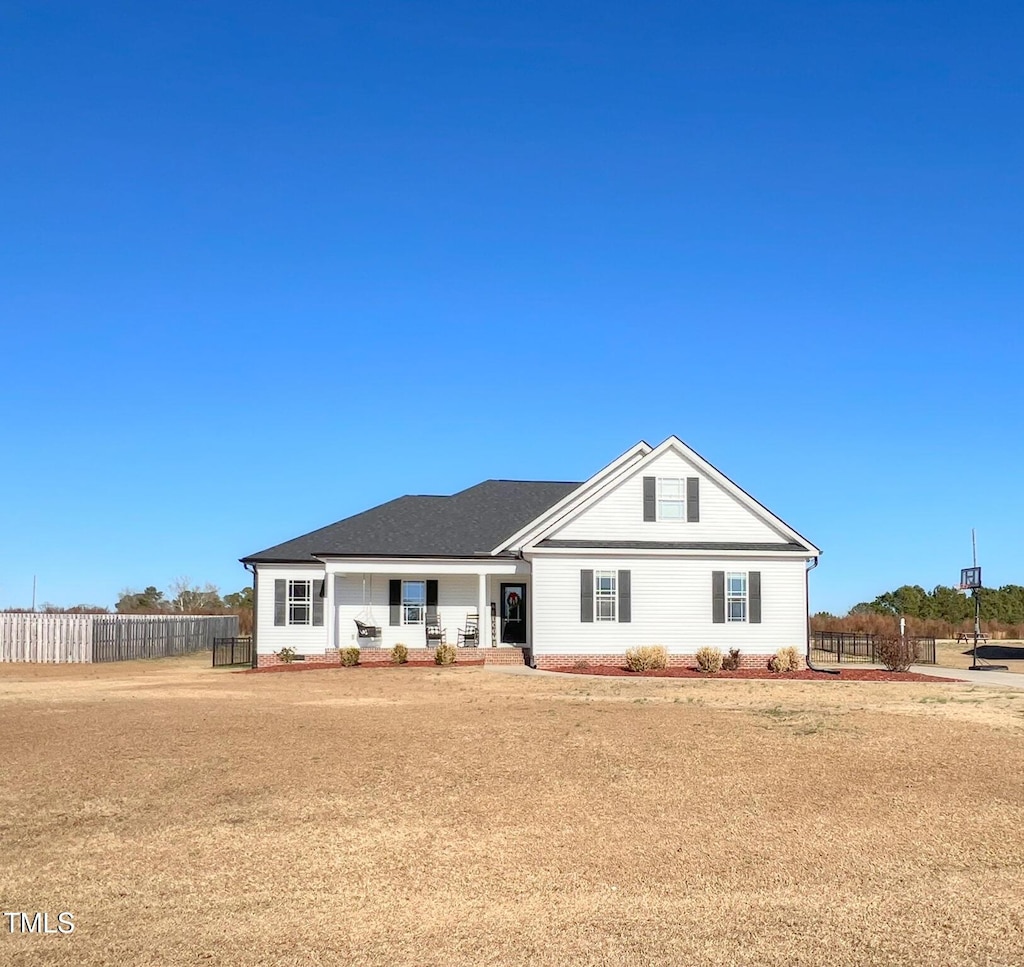 single story home featuring covered porch