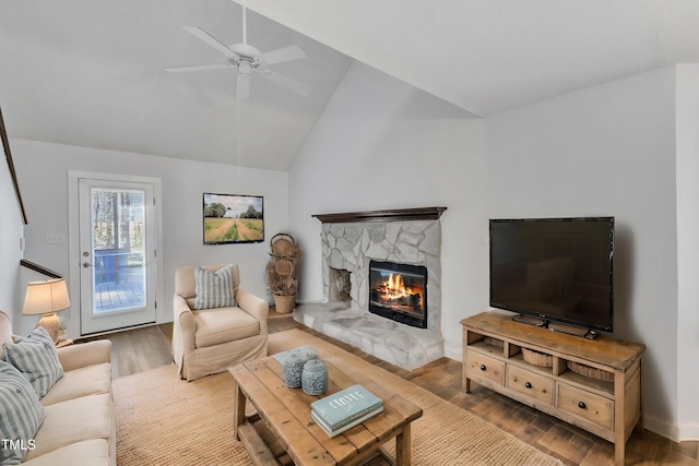 3617 Top Of The Pines Ct, Raleigh, NC 27604 - living area featuring a fireplace, wood finished floors, a ceiling fan, and high vaulted ceiling