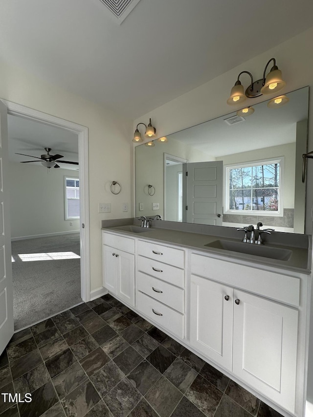 bathroom featuring vanity and ceiling fan