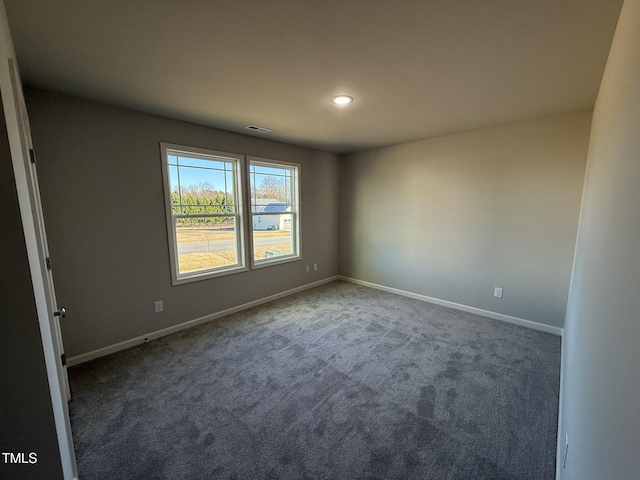 spare room featuring carpet floors