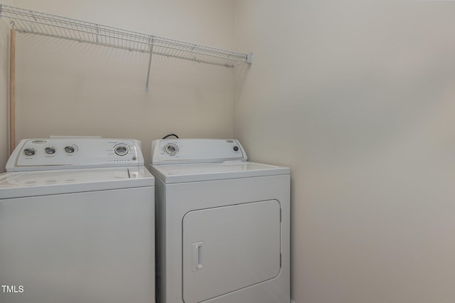 washroom featuring washer and clothes dryer