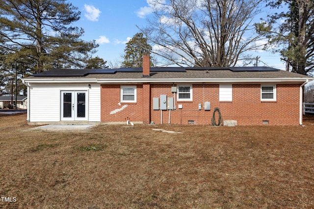 back of house featuring a lawn