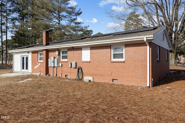 back of house featuring french doors