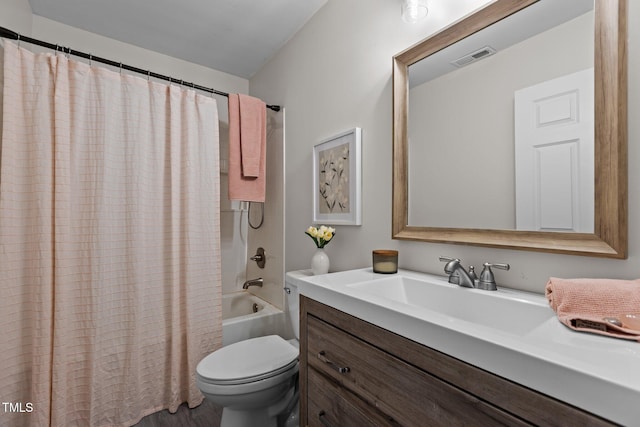 full bathroom with vanity, wood-type flooring, toilet, and shower / bath combo with shower curtain