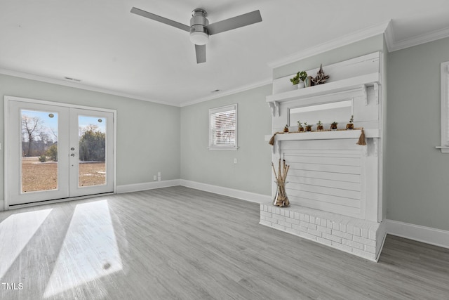 unfurnished living room featuring hardwood / wood-style flooring, ceiling fan, ornamental molding, and french doors