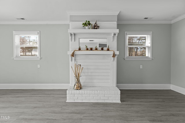 details with ornamental molding and wood-type flooring