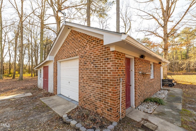 view of home's exterior featuring a garage and an outdoor structure