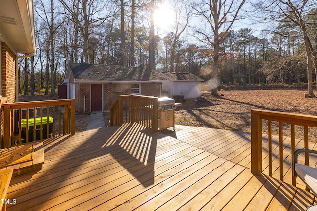 wooden terrace with an outdoor structure