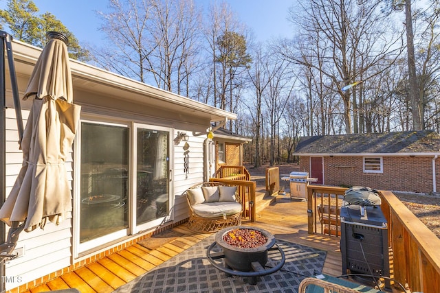 deck featuring a fire pit