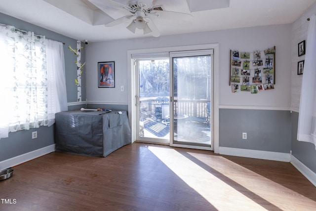 doorway to outside with ceiling fan and wood-type flooring