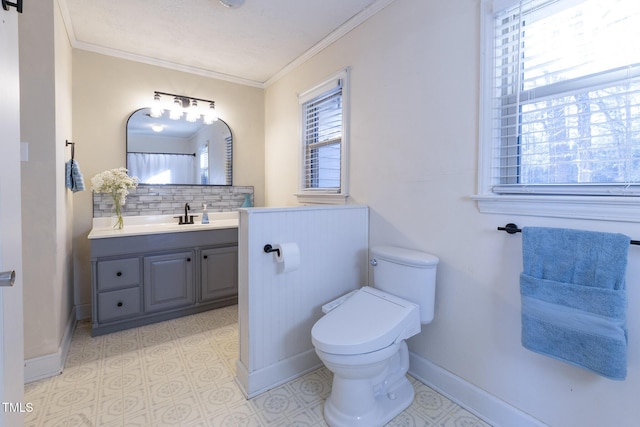 bathroom featuring vanity, tasteful backsplash, toilet, and ornamental molding