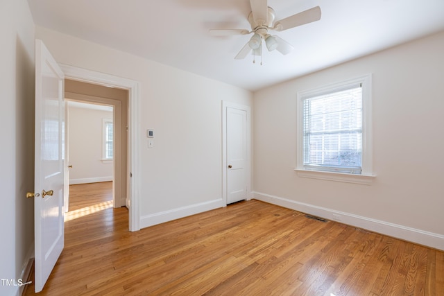 spare room featuring ceiling fan and light hardwood / wood-style floors