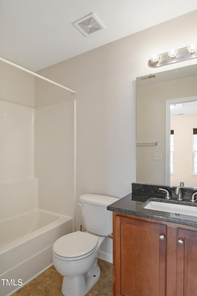 full bathroom featuring bathing tub / shower combination, tile patterned floors, vanity, and toilet