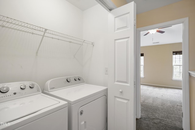 clothes washing area with washing machine and dryer, carpet floors, and ceiling fan