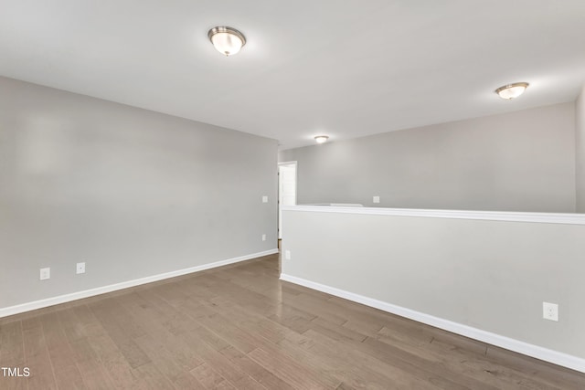 spare room featuring hardwood / wood-style floors